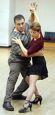 Juan Avendaño and Sue Lindenberg practice a dance move during a tango dancing class at Dance Unlimited in Morgan Hill.